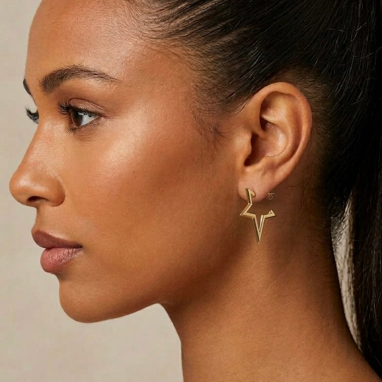 vega stern ohrringe getragen statement gold | eliée jewelry